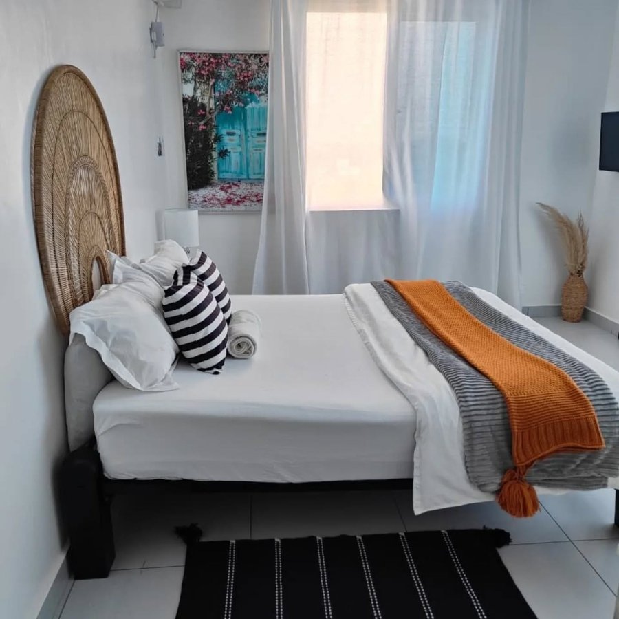 Coastal afro-modern interior